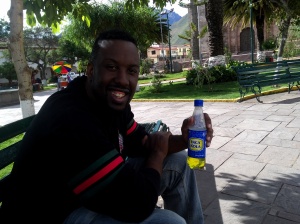 Chillin' at the plaza in Urubamba with an Inka Cola. 